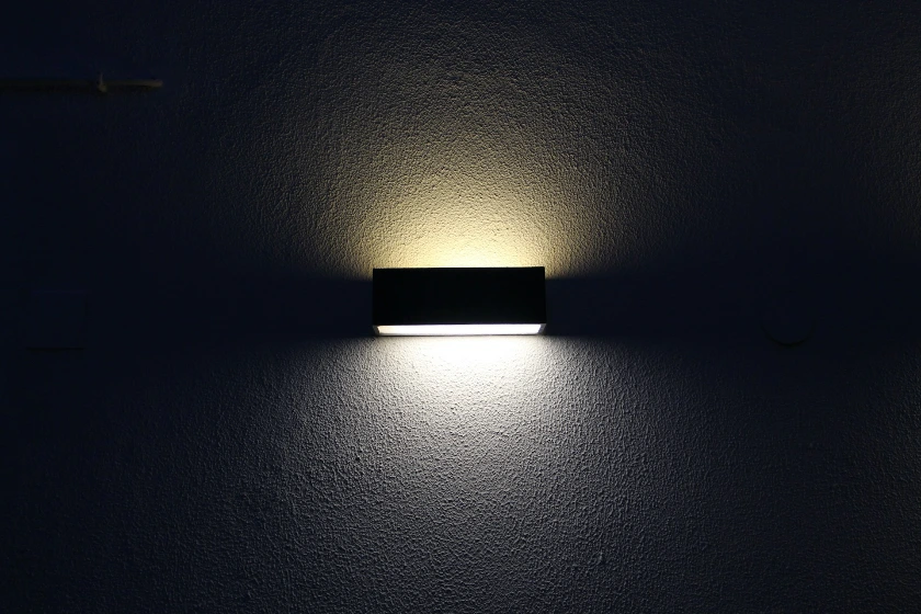 rectangular black sconces with dim light